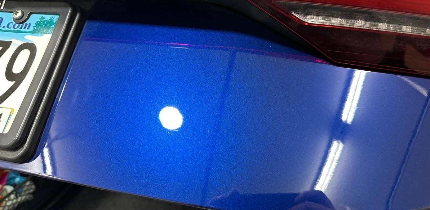 Metallic blue paint after correction with restored gloss