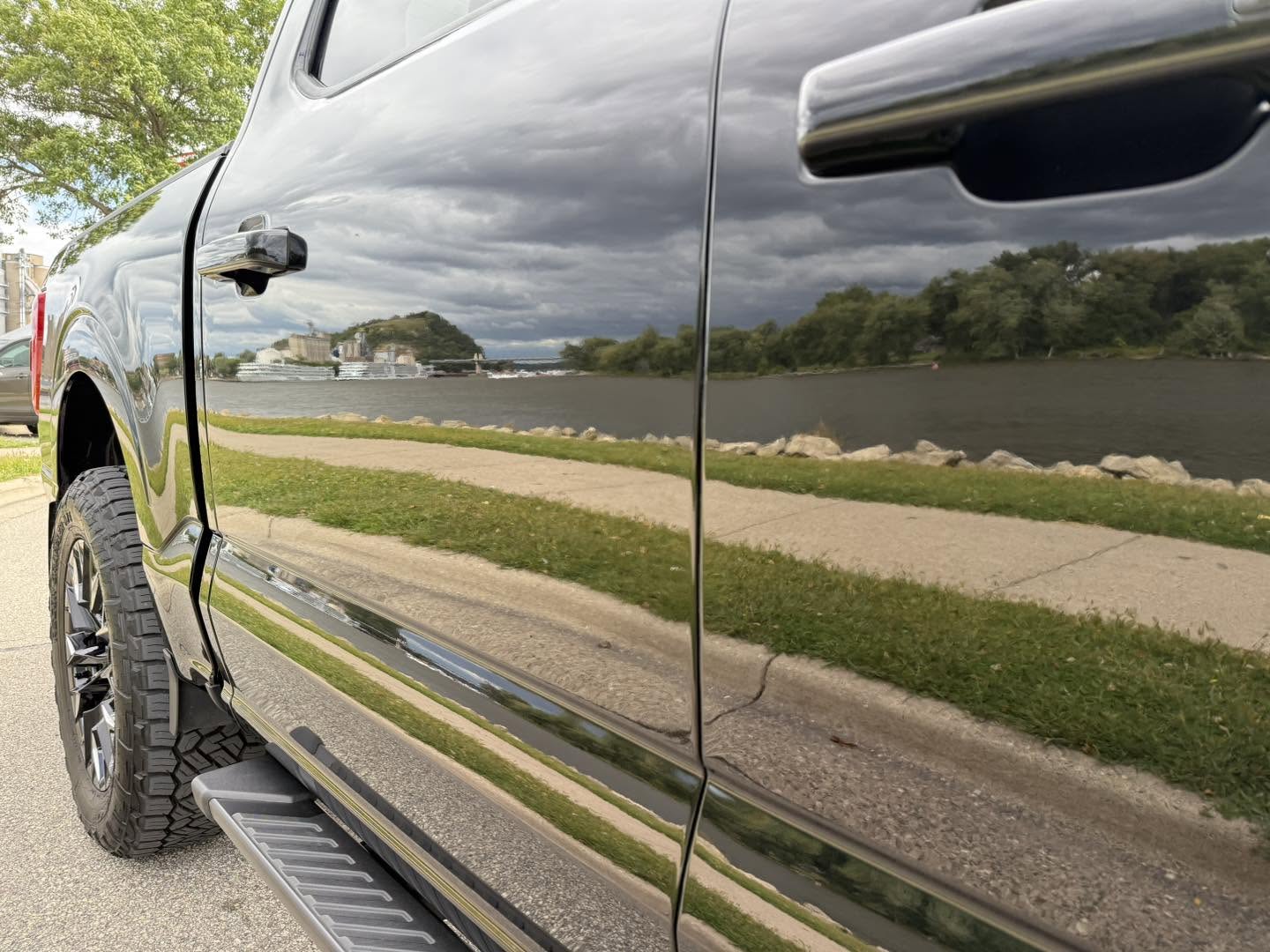 Pickup truck with deep gloss reflection along the Mississippi River in Red Wing, Minnesota